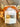 Packaged product labeled 'Autumn Harvest' with decorative elements on a wooden surface