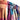 Row of colorful scarves with a gradient effect.