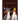 Card with two woodpeckers wearing flower hats and 'Happy Anniversary' text on a dark background