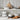 Set of white cookware on a kitchen shelf with wooden cutting board and eggs.