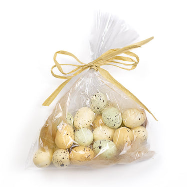A clear plastic bag tied with a yellow ribbon, containing blue and white speckled eggs, likely representing Springhill Eggs.