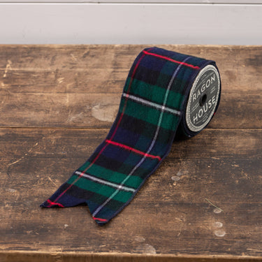 Ragon House Tartan Ribbon on Spool. Ribbon is Navy Blue/Green/Red/White tartan