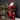 Ragon House Santa with Red Fur-Trimmed Robe. He is holding a tree and a staff. His belt is full of gifts