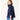 Woman wearing a navy blue jacket and blue jeans on a white background