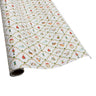A roll of wrapping paper with a festive holiday pattern featuring Christmas elves, ornaments, and wreaths on a white background.