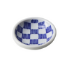 Small white bowl with blue checkered pattern on a white background