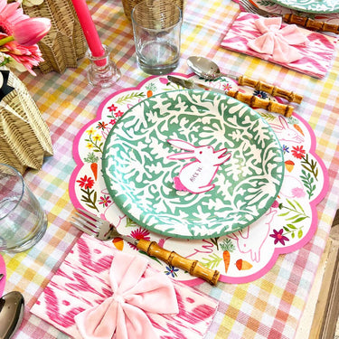 Table set with Scalloped edge round paper placemat with rabbits, carrots and spring flowers