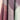 Close-up of fabric swatches in purple, gray, and green on a beige background