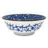 Ceramic bowl with blue floral pattern on a white background