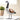 Decorative goose figure on a white surface with a blurred background