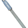 A Microplane Premium Series zester and grater with a sky blue handle and a rasp-style stainless steel blade.